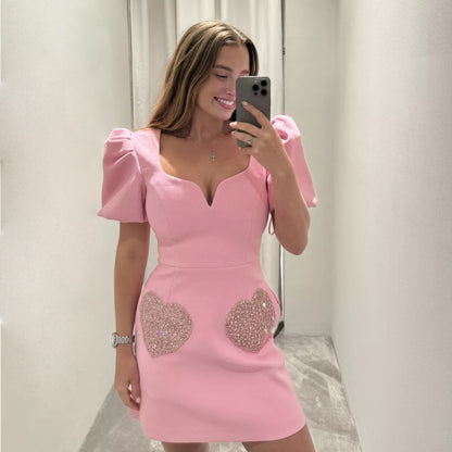 Ropa de mujer con escote en V, mangas abullonadas y lentejuelas en color rosa